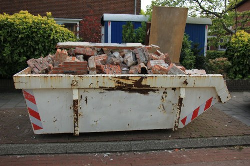 Rubbish removal team handling waste collection paperwork