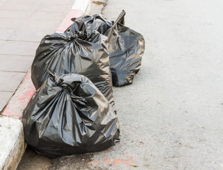 Residential garbage pickup in Acton with recycling bins