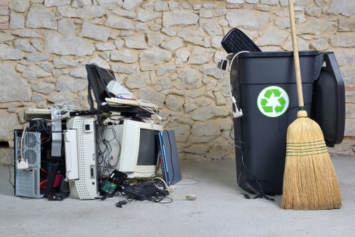 Careful furniture collection during sofa removal in Acton